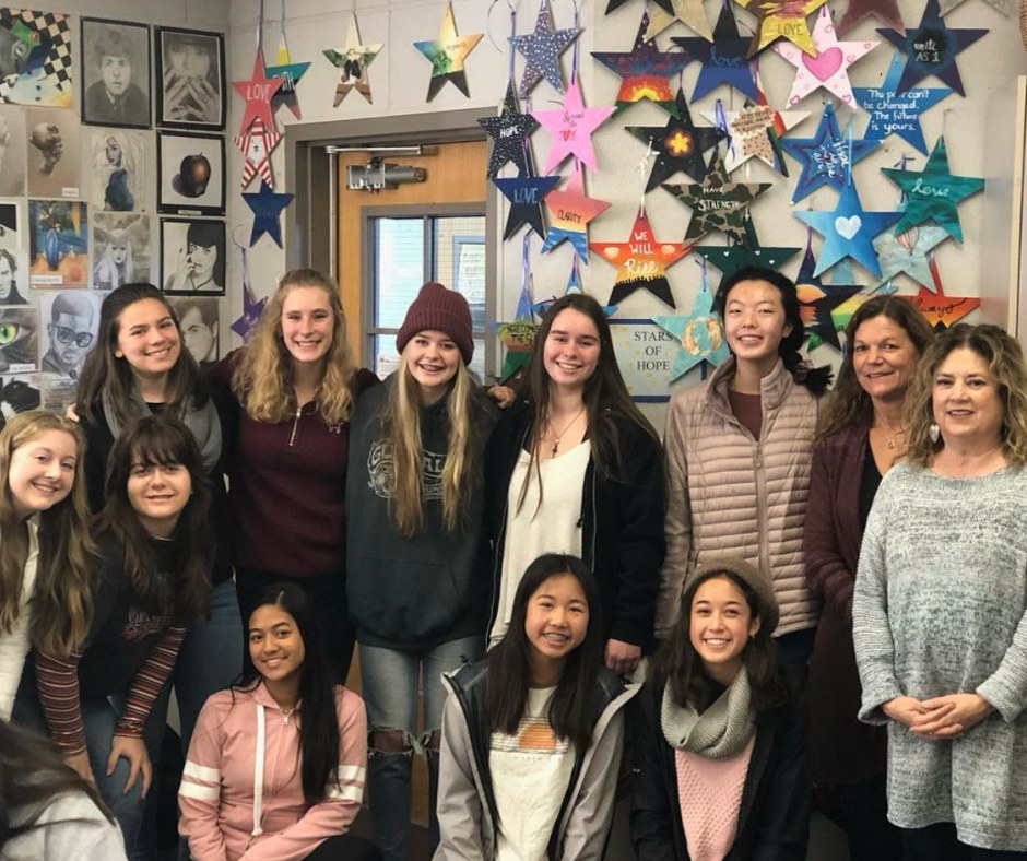 Stars of HOPE club in California create a "Wall of HOPE" in a classroom.